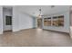 Spacious living area featuring tile floors, ceiling fan, and lots of natural light at 15564 W Mescal St, Surprise, AZ 85379