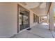 Covered patio with sliding glass door and view of backyard at 15564 W Mescal St, Surprise, AZ 85379