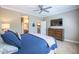 Bedroom features a king bed with ensuite bathroom access at 16913 W Holly St, Goodyear, AZ 85395