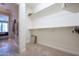 Walk-in closet with plenty of storage space and access to bedroom at 16913 W Holly St, Goodyear, AZ 85395