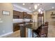 The kitchen showcases dark wood cabinets and modern pendant lighting at 16913 W Holly St, Goodyear, AZ 85395