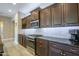 The kitchen features stainless steel appliances, granite countertops, and dark wood cabinetry at 16913 W Holly St, Goodyear, AZ 85395