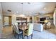 Open layout of dining, living and kitchen areas creates a welcoming space for gatherings and daily living at 16913 W Holly St, Goodyear, AZ 85395