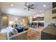 Open-concept living space connecting the living room, dining area, and kitchen for easy entertaining at 16913 W Holly St, Goodyear, AZ 85395