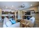 Spacious living room with an open floor plan, seamlessly connecting the kitchen and living areas at 16913 W Holly St, Goodyear, AZ 85395