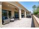 Open patio featuring pavers, covered seating, and outdoor grill at 16913 W Holly St, Goodyear, AZ 85395