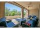Inviting covered patio with a fire pit table and cushioned seating at 16913 W Holly St, Goodyear, AZ 85395