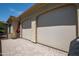 Enclosed patio with roll down sunscreens for comfortable outdoor living in a paver-laid lounge area at 16913 W Holly St, Goodyear, AZ 85395