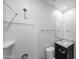 Bright bathroom showcasing shower, toilet, and vanity with granite countertop at 17290 W Daley Ln, Surprise, AZ 85387