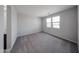 Bedroom with carpeted floor, and multiple windows at 17290 W Daley Ln, Surprise, AZ 85387