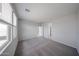 Bedroom featuring carpeted floor and large windows at 17290 W Daley Ln, Surprise, AZ 85387
