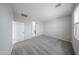 The bedroom has a carpeted floor and a window at 17290 W Daley Ln, Surprise, AZ 85387