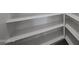 Walk-in pantry with multiple shelves for optimal storage solutions at 17290 W Daley Ln, Surprise, AZ 85387