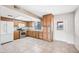 Kitchen showcasing tile flooring, stainless steel appliances and wooden cabinets at 1827 W Bluefield Ave, Phoenix, AZ 85023