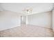 Living room showcasing tile flooring, neutral colored walls, and a ceiling fan at 1827 W Bluefield Ave, Phoenix, AZ 85023
