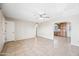 Living room featuring tile flooring, a ceiling fan and an open archway at 1827 W Bluefield Ave, Phoenix, AZ 85023