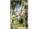 Aerial view of the community pool area, including pool, patio, and putting green at 19400 N Westbrook Pkwy # 216, Peoria, AZ 85382