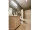 Bathroom featuring a single sink, wood vanity with hardware, a shower and a toilet at 19400 N Westbrook Pkwy # 216, Peoria, AZ 85382