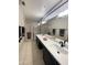 Bathroom features a dual sink vanity and a separate shower with glass doors at 19400 N Westbrook Pkwy # 216, Peoria, AZ 85382