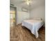 Bedroom features a cozy queen bed, laminate floors and a large closet for plenty of storage at 19400 N Westbrook Pkwy # 216, Peoria, AZ 85382