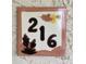 Close-up of house number 216 tile, adding a unique decorative accent at 19400 N Westbrook Pkwy # 216, Peoria, AZ 85382