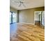 The sunny living room features wood floors and a glass sliding door to a balcony at 19400 N Westbrook Pkwy # 216, Peoria, AZ 85382