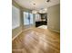Open layout living room showcasing wood floors and modern lighting at 19400 N Westbrook Pkwy # 216, Peoria, AZ 85382
