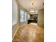Open concept living room with wood floors and large windows at 19400 N Westbrook Pkwy # 216, Peoria, AZ 85382