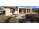 Inviting backyard patio surrounded by mature landscaping, perfect for outdoor entertaining and relaxation at 21003 N Circle Cliffs Dr, Surprise, AZ 85387