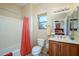 Well-lit bathroom featuring a shower/tub combo, a vanity sink, and a window for natural light at 21003 N Circle Cliffs Dr, Surprise, AZ 85387