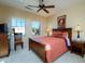 Bedroom with carpet, ceiling fan and a full-size bed at 21003 N Circle Cliffs Dr, Surprise, AZ 85387