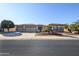Charming single-story home featuring a three-car garage and desert landscaping for low maintenance at 21003 N Circle Cliffs Dr, Surprise, AZ 85387