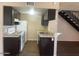 Updated kitchen boasts modern appliances, sleek countertops, and plenty of cabinet space at 2133 W Turney Ave # C88, Phoenix, AZ 85015
