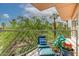 Relaxing balcony with lounge chair offers serene views of trees and blue sky at 2201 N Central Ave # 3D, Phoenix, AZ 85004