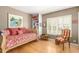 Bedroom with a daybed, built-in shelving, and a window with natural light at 2201 N Central Ave # 3D, Phoenix, AZ 85004