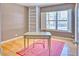 Bright bedroom with built-in shelving, hardwood floors, a desk, and ample natural light at 2201 N Central Ave # 3D, Phoenix, AZ 85004