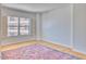 Bedroom with hardwood floors, large windows and a colorful area rug at 2201 N Central Ave # 3D, Phoenix, AZ 85004