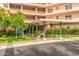Inviting entrance to Phoenix Towers with covered entry, lush landscaping, and clear signage at 2201 N Central Ave # 3D, Phoenix, AZ 85004