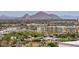 Sweeping city view featuring modern buildings, lush trees, and a striking mountain backdrop at 2201 N Central Ave # 3D, Phoenix, AZ 85004