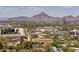 Scenic city view with nearby buildings, lush greenery, and a mountain in the distance at 2201 N Central Ave # 3D, Phoenix, AZ 85004