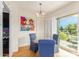 Cozy dining area features a modern chandelier and balcony access for outdoor enjoyment at 2201 N Central Ave # 3D, Phoenix, AZ 85004