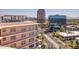 Scenic neighborhood shot featuring the building's facade and surrounding urban landscape with other buildings at 2201 N Central Ave # 3D, Phoenix, AZ 85004