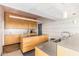 Bright kitchen with modern cabinetry, stainless steel countertops, and stylish lighting at 2201 N Central Ave # 3D, Phoenix, AZ 85004
