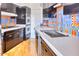 Modern kitchen with sleek cabinetry, white countertop and colorful tile backsplash at 2201 N Central Ave # 3D, Phoenix, AZ 85004