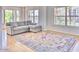 Bright living room featuring a comfortable sectional sofa and large windows offering plenty of natural light at 2201 N Central Ave # 3D, Phoenix, AZ 85004