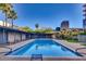 Sparkling community pool surrounded by lush landscaping and comfortable seating at 2201 N Central Ave # 3D, Phoenix, AZ 85004