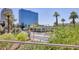 Balcony view featuring lush greenery and city buildings in the background at 2201 N Central Ave # 3D, Phoenix, AZ 85004