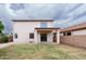 Backyard showcasing a well-maintained lawn and partial patio cover at 231 N Nash Way, Chandler, AZ 85225