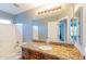 Bathroom with granite countertop and vanity, framed mirror and shower/tub combo at 231 N Nash Way, Chandler, AZ 85225