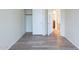 Spacious bedroom boasting hardwood floors and closet storage at 231 N Nash Way, Chandler, AZ 85225